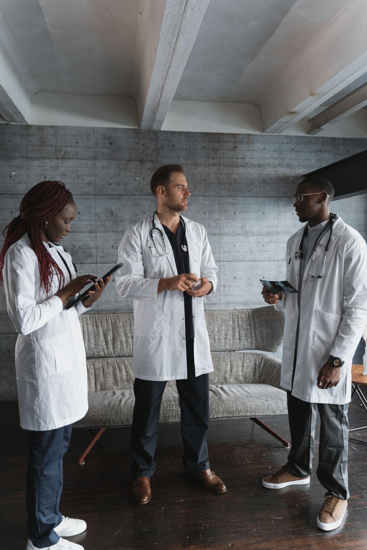 Three medical professionals discussing care together
